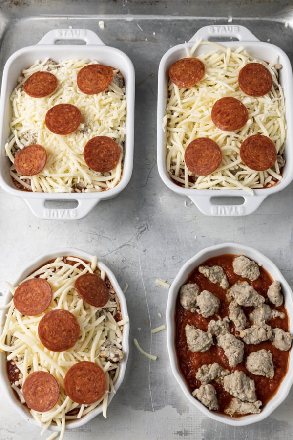 There’s no easier, more comforting dinner on the fly than this easy pizza bowl recipe! Garlicky marinara sauce, mozzarella cheese, pepperoni, succulent Italian sausage, and whatever else you love as pizza toppings are baked in individual servings until the cheese is bubbling and melted and the pepperoni is crispy at the edges.