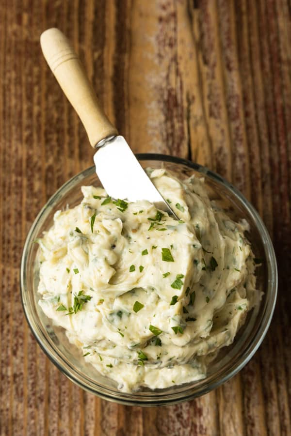 There are very few meals that are not immeasurably improved by a crusty garlic bread spread lavishly with melted butter, studded with roasted garlic, and carpeted with abundant fresh herbs. Time is often short, though, so keep a batch of this heavenly, fragrant garlic spread for bread on hand to make short work of big flavour.