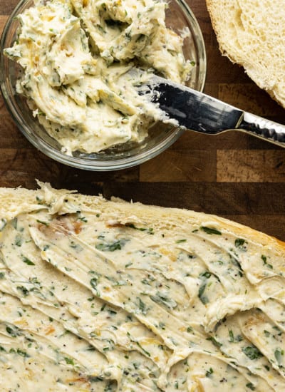 There are very few meals that are not immeasurably improved by a crusty garlic bread spread lavishly with melted butter, studded with roasted garlic, and carpeted with abundant fresh herbs. Time is often short, though, so keep a batch of this heavenly, fragrant garlic spread for bread on hand to make short work of big flavour.