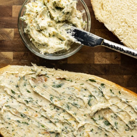 There are very few meals that are not immeasurably improved by a crusty garlic bread spread lavishly with melted butter, studded with roasted garlic, and carpeted with abundant fresh herbs. Time is often short, though, so keep a batch of this heavenly, fragrant garlic spread for bread on hand to make short work of big flavour.