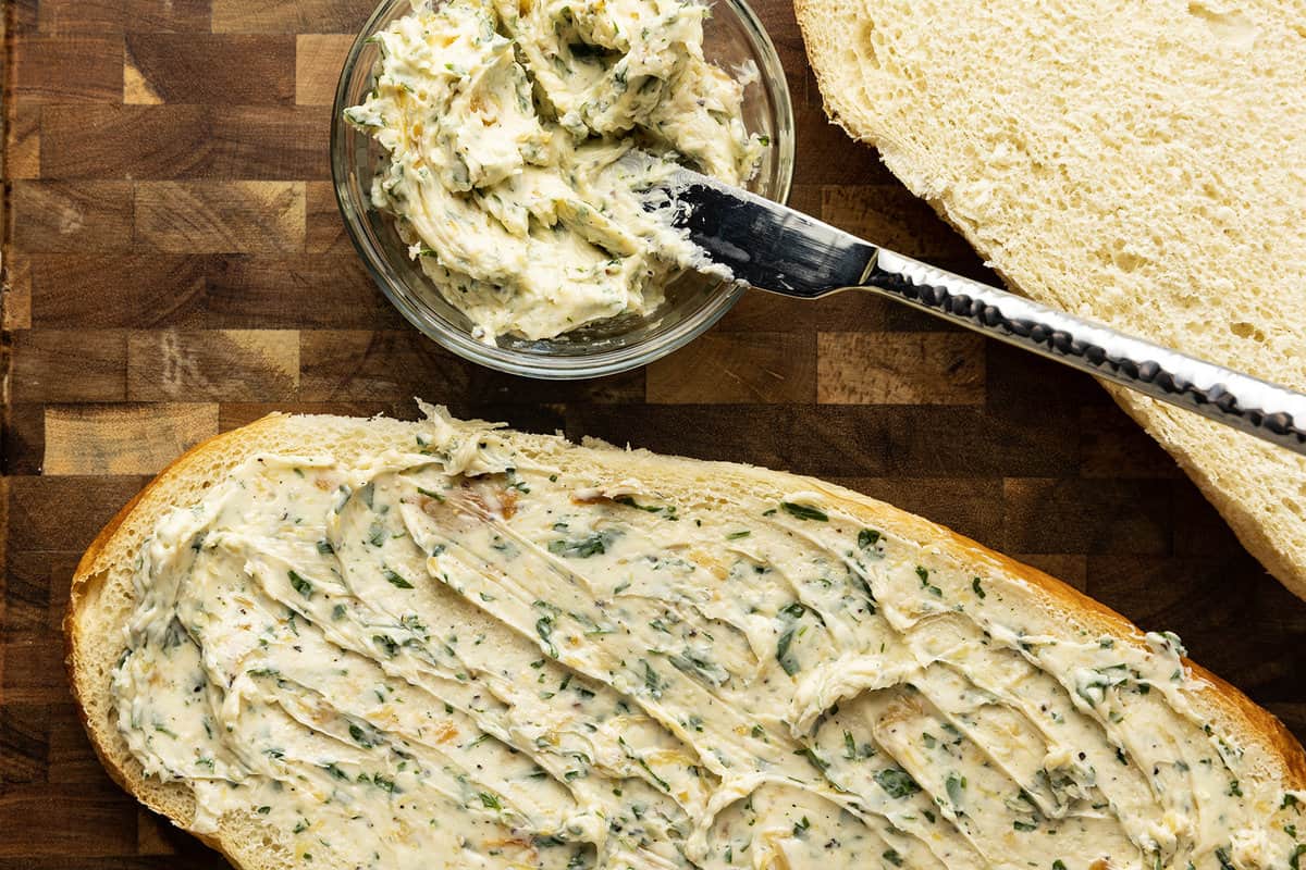 There are very few meals that are not immeasurably improved by a crusty garlic bread spread lavishly with melted butter, studded with roasted garlic, and carpeted with abundant fresh herbs. Time is often short, though, so keep a batch of this heavenly, fragrant garlic spread for bread on hand to make short work of big flavour.