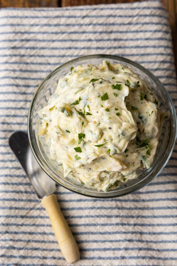 There are very few meals that are not immeasurably improved by a crusty garlic bread spread lavishly with melted butter, studded with roasted garlic, and carpeted with abundant fresh herbs. Time is often short, though, so keep a batch of this heavenly, fragrant garlic spread for bread on hand to make short work of big flavour.