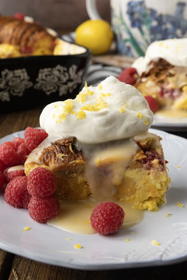 Rich, buttery, & indulgent, this creamy lemon and raspberry croissant bread pudding recipe is almost unbelievably easy to make. The flaky, layered croissant top gives way to the silky, vanilla and lemon scented custard that is studded with fresh raspberries. Optional cream cheese dotted through the custard makes this extraordinary decadent bread pudding taste a little like a cheesecake. It takes so few minutes of hands-on time to make any breakfast, brunch, or dessert a memorable occasion.