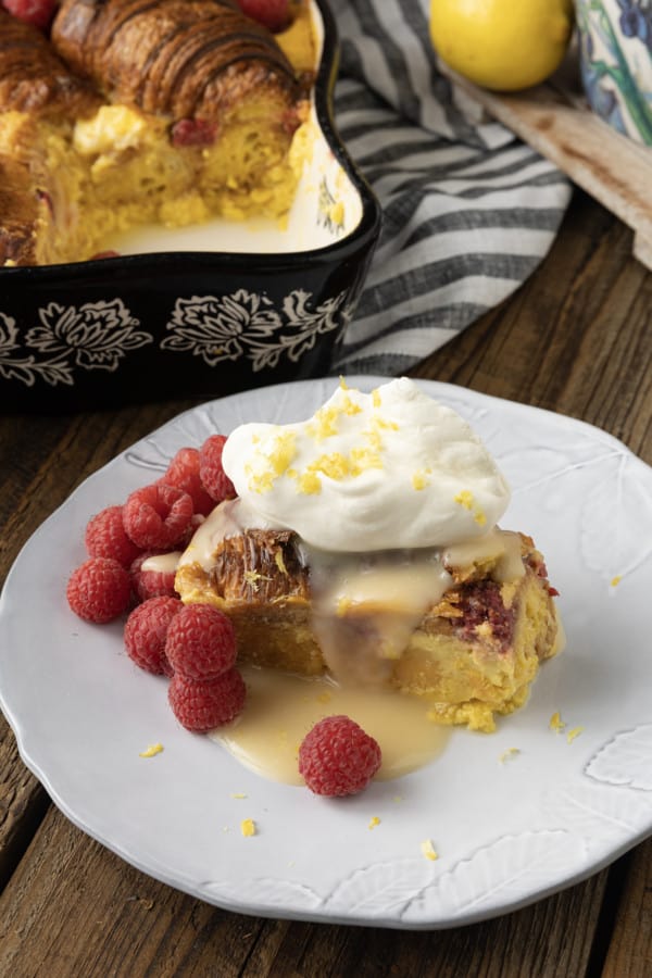 Rich, buttery, & indulgent, this creamy lemon and raspberry croissant bread pudding recipe is almost unbelievably easy to make. The flaky, layered croissant top gives way to the silky, vanilla and lemon scented custard that is studded with fresh raspberries. Optional cream cheese dotted through the custard makes this extraordinary decadent bread pudding taste a little like a cheesecake. It takes so few minutes of hands-on time to make any breakfast, brunch, or dessert a memorable occasion.