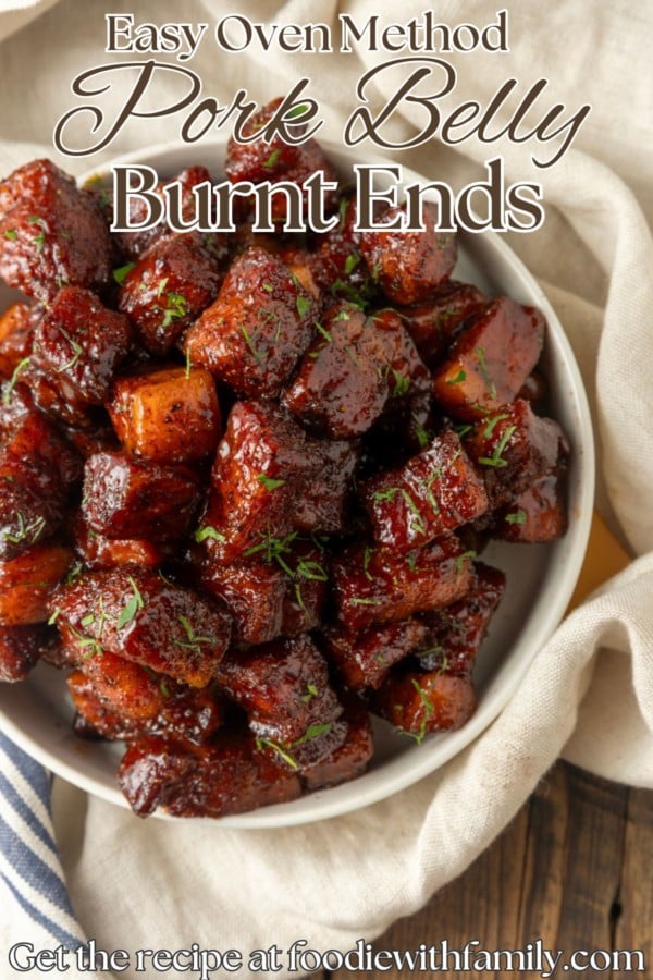 pork belly bites in a bowl with text overlay describing the photo