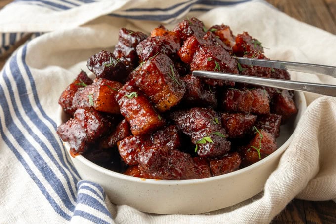 smoked pork belly bites in a bowl.