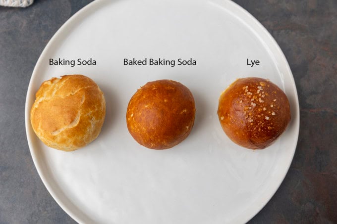 Pretzel bites prepared three ways on a white plate.