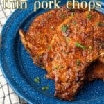 thin pork chops on blue plate with text overlay describing the photo