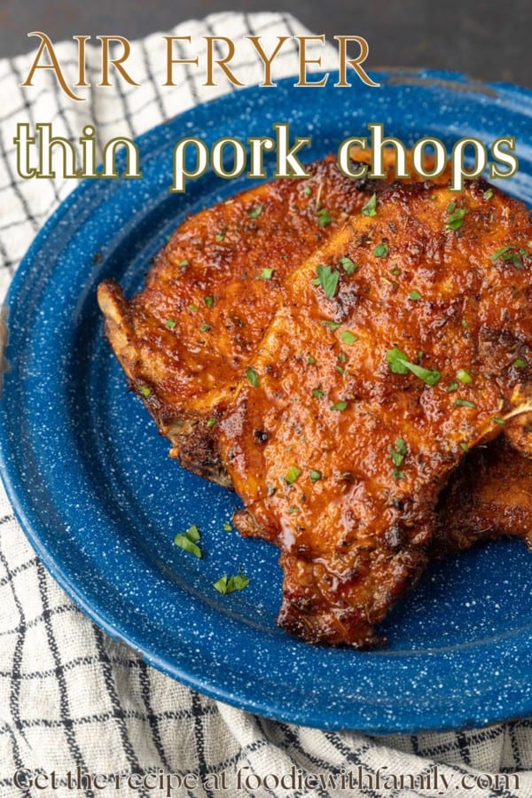 thin pork chops on blue plate with text overlay describing the photo