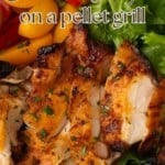 chicken thighs grilled on a pellet grill on a plate with lettuce, tomatoes, and cucumbers and a text overlay describing the photo