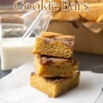 snickerdoodle cookie bars with a glass jar of milk and text overlay describing photo