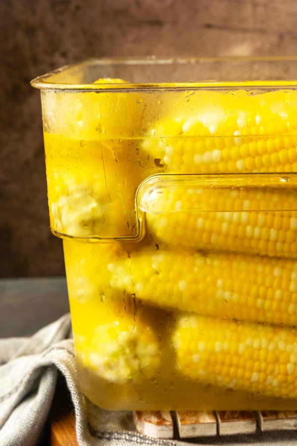 blanched sweet corn in an ice water bath