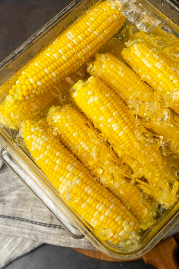 blanched sweet corn in an ice water bath