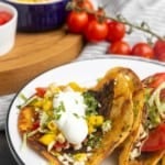 smash on stacked plates with toppings in bowls and text describing the photo