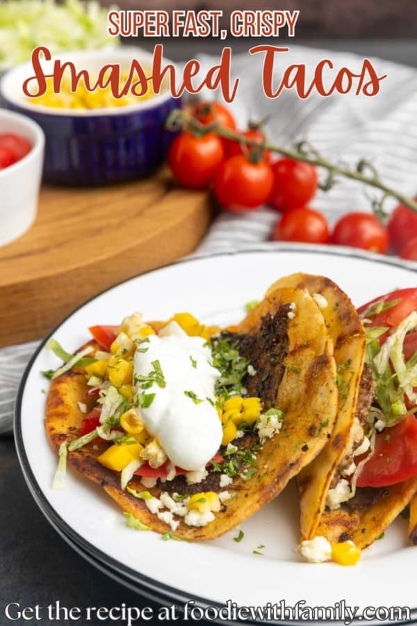 smash on stacked plates with toppings in bowls and text describing the photo