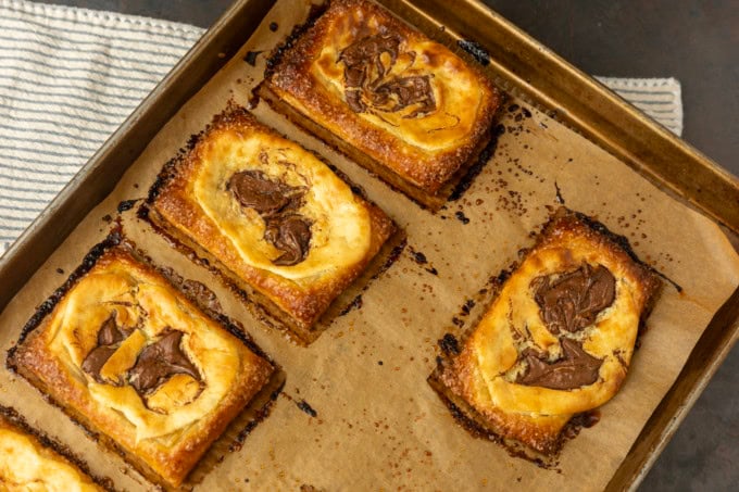 nutella cream cheese puff pastry with thyme on parchment lined pan