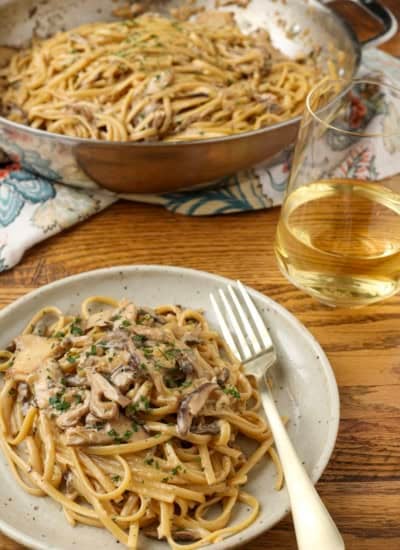 miso mushroom pasta on a plate and in a pan