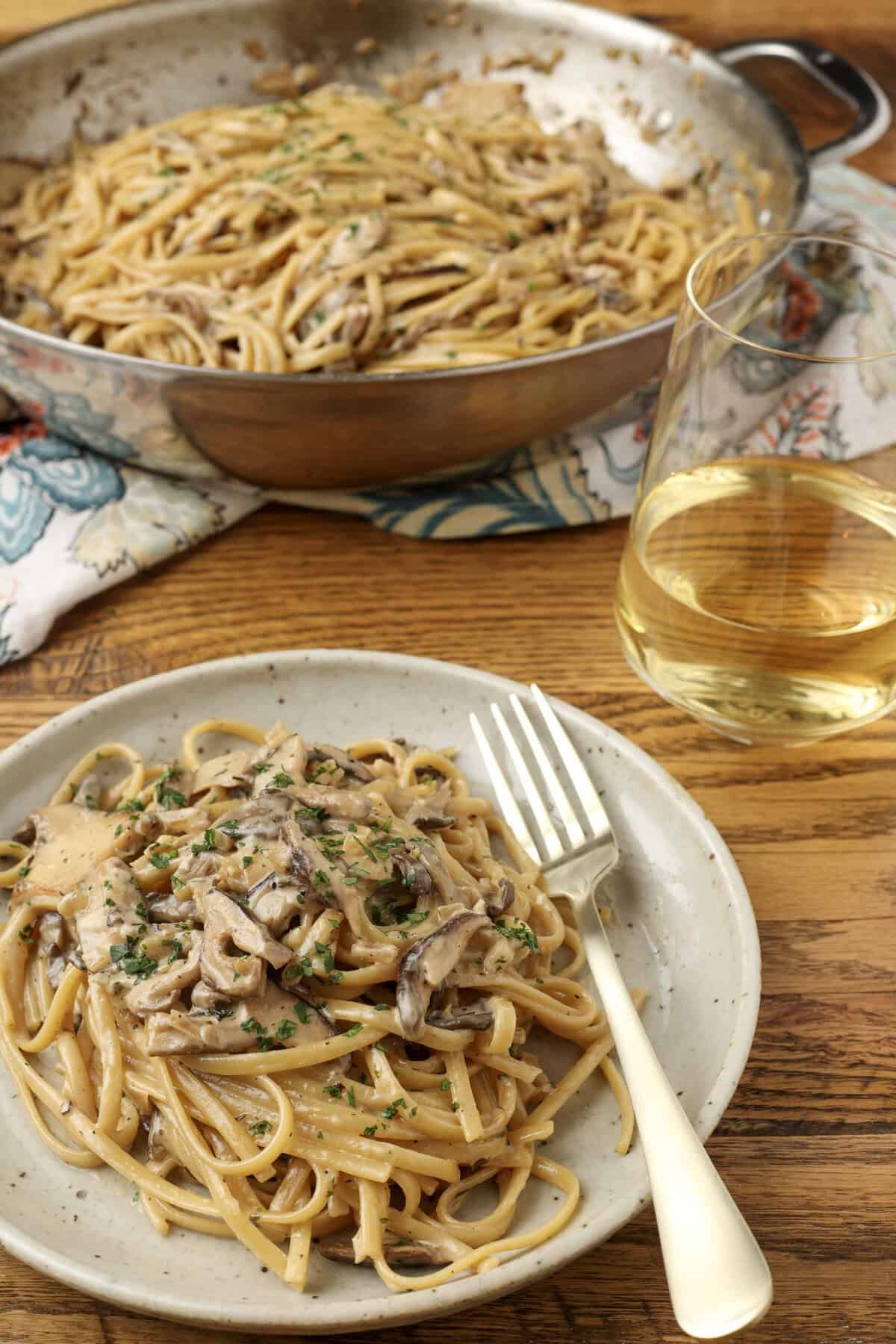 miso mushroom pasta on a plate and in a pan