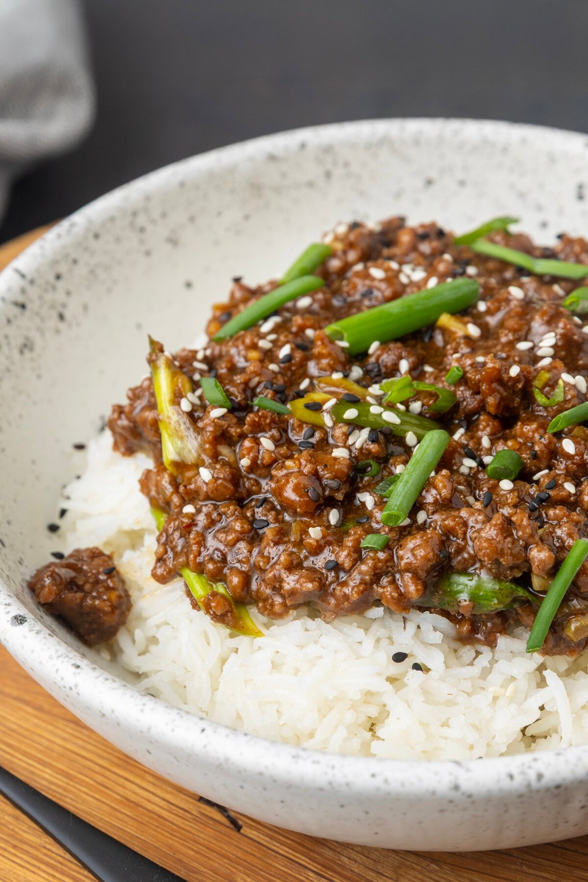 mongolian ground beef on rice in a bowl