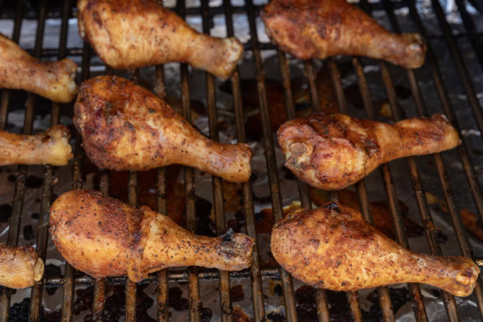 smoked chicken drumsticks on a grill