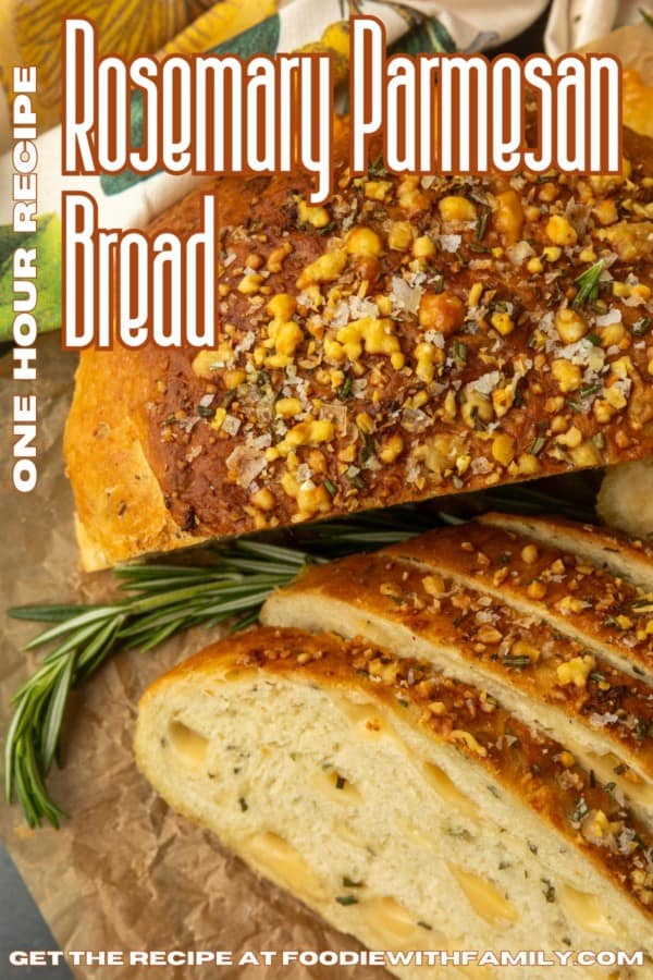 partially sliced one hour rosemary parmesan bread on parchment paper with text describing the photo over it