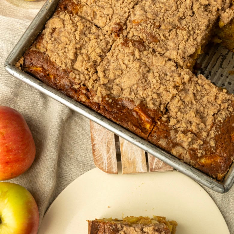 apple coffee cake in a pan and on a plate