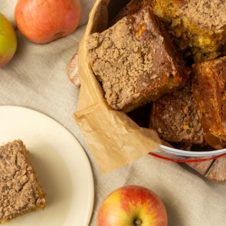 apple coffee cake in a tin and on a plate