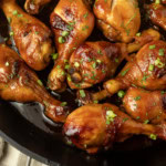 baked honey garlic chicken in a cast-iron pan