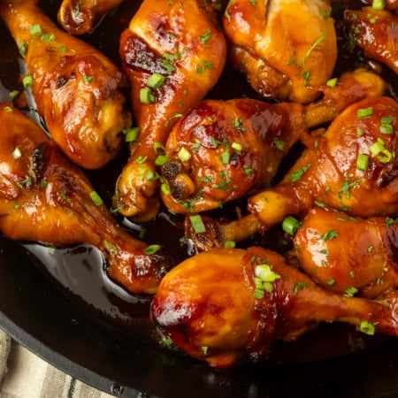 baked honey garlic chicken in a cast-iron pan