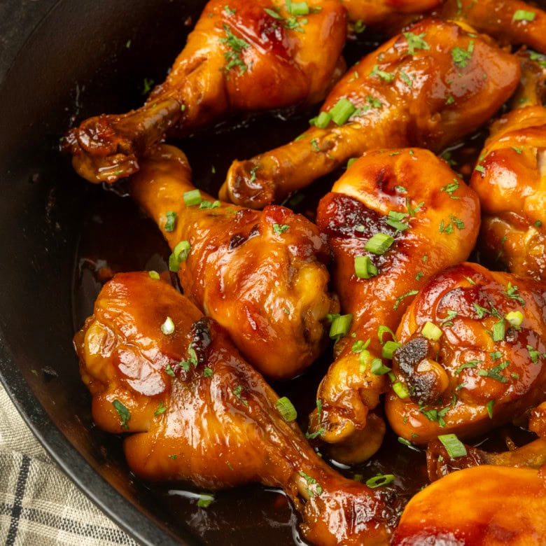 baked honey garlic chicken in a cast-iron pan