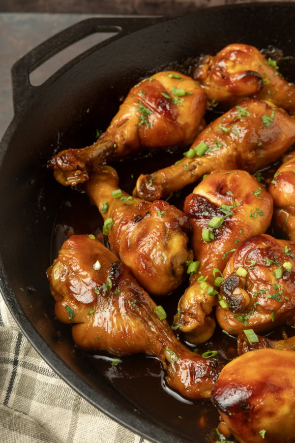 baked honey garlic chicken in a cast-iron pan