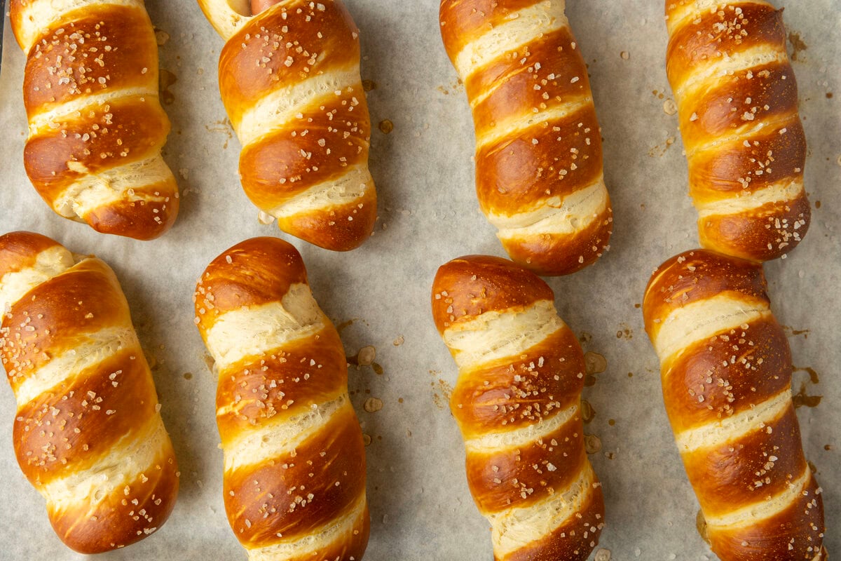 pretzel dogs on parchment paper on a pan