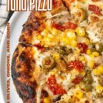 tuna pizza with corn, olives, onions, and roasted red peppers