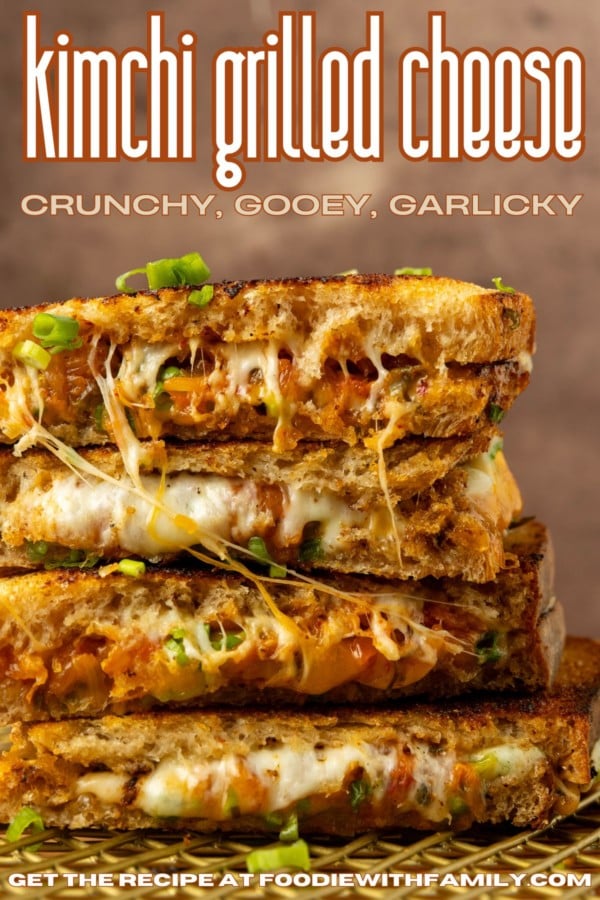 stack of kimchi grilled cheese with a lot of melted cheese pulling out of it and text overlay describing the photo