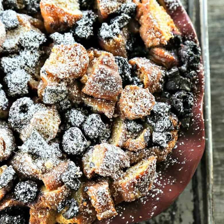 Chocolate Cherry Doughnut Bread Pudding is the creamiest, richest, most souffle-like bread pudding of leftover doughnuts, dark chocolate chunks, and sweet, black cherries.