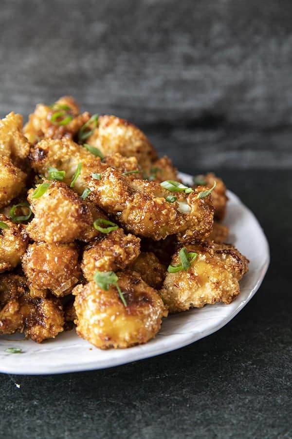 These incredible and incredibly simple, crunchy, baked Cauliflower Wings are sublimely sticky courtesy of the flavourful ginger and garlic teriyaki glaze.