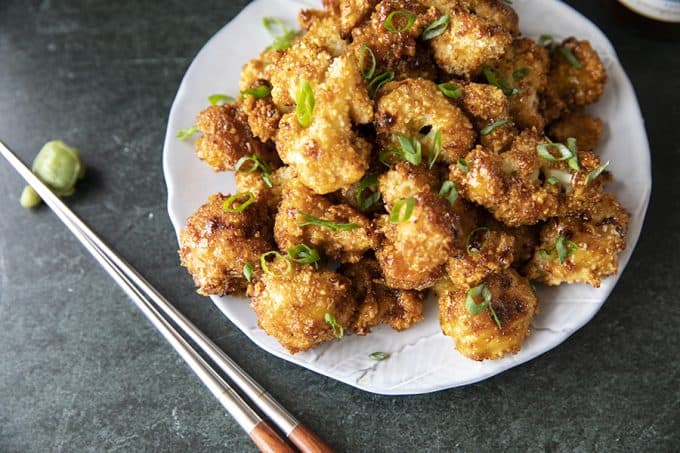 These incredible and incredibly simple, crunchy, baked Cauliflower Wings are sublimely sticky courtesy of the flavourful ginger and garlic teriyaki glaze.