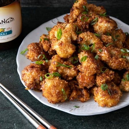 These incredible and incredibly simple, crunchy, baked Cauliflower Wings are sublimely sticky courtesy of the flavourful ginger and garlic teriyaki glaze.