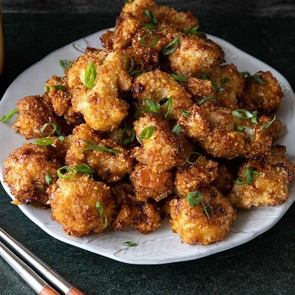 These incredible and incredibly simple, crunchy, baked Cauliflower Wings are sublimely sticky courtesy of the flavourful ginger and garlic teriyaki glaze.