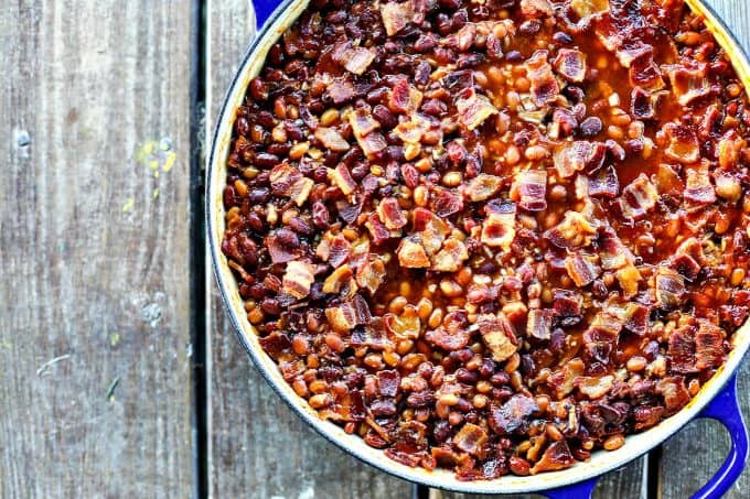 Barbecue Bacon Spicy Baked Beans are chock full of browned pork sausage, bacon, and enough spicy barbecue sauce to be so flavourful and so perfect that no one will ever believe these start with canned beans.