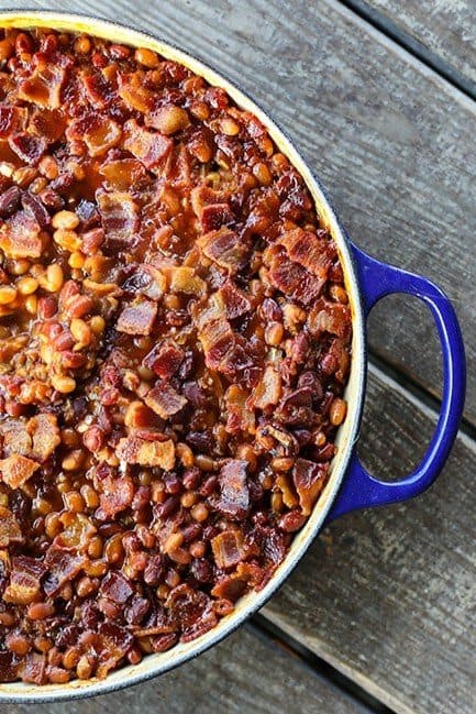 Barbecue Bacon Spicy Baked Beans are chock full of browned pork sausage, bacon, and enough spicy barbecue sauce to be so flavourful and so perfect that no one will ever believe these start with canned beans.