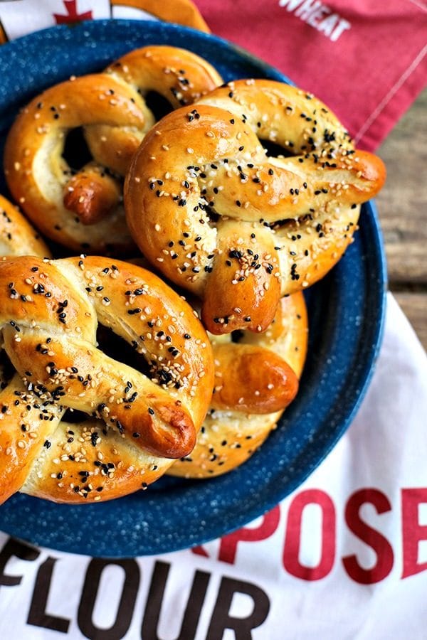 Buttery, salty, and topped with delicious sesame seeds, these chewy yet tender, golden brown sourdough soft pretzels are truly the best. Bonus: This is made with unfed starter, so no special timing needed!