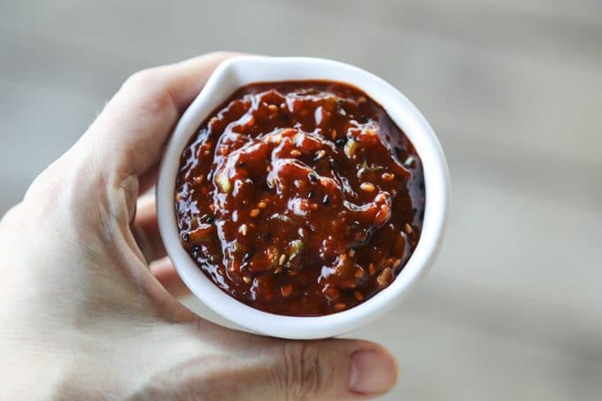 Ssamjang Korean Spicy Dipping Sauce is as easy as it is delicious and habit forming! Serve as a dip for Korean Barbecue, pork roasts, bo ssam, on lettuce wraps, or any other number of delicious things!