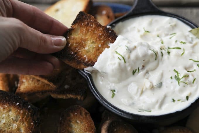 Warm, garlicky goat cheese fondue with tender pieces of marinated artichoke heart is perfectly dippable for crackers, vegetables, crusty bread, and pretzels, but it isn’t just a one-trick pony... When it’s room temperature or cold, it makes the most incredible spread for sandwiches. 