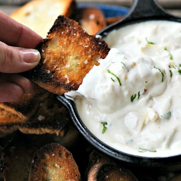Warm, garlicky goat cheese fondue with tender pieces of marinated artichoke heart is perfectly dippable for crackers, vegetables, crusty bread, and pretzels, but it isn’t just a one-trick pony... When it’s room temperature or cold, it makes the most incredible spread for sandwiches.