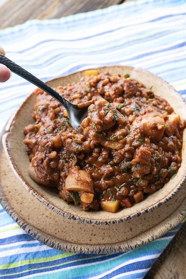 Chorizo Chili is hearty, spicy, slow-simmered chorizo in smoky tomato sauce with tender potatoes, carrots, and lentils. This is serious comfort food!