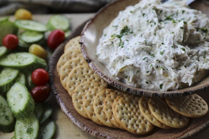 Warm, garlicky goat cheese fondue with tender pieces of marinated artichoke heart is perfectly dippable for crackers, vegetables, crusty bread, and pretzels, but it isn’t just a one-trick pony... When it’s room temperature or cold, it makes the most incredible spread for sandwiches. 