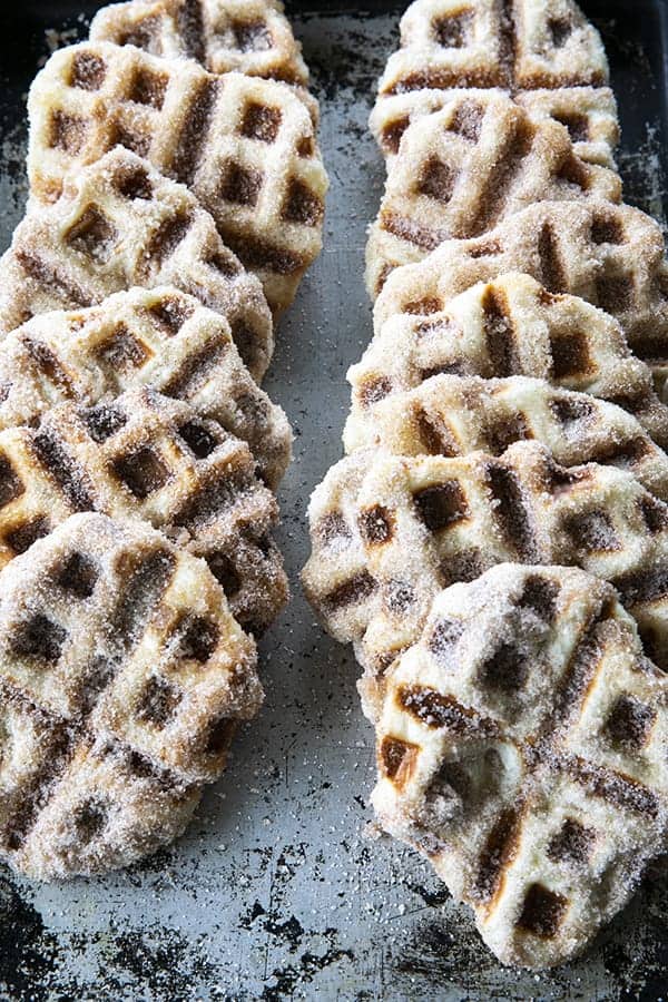 Crispy edged, cinnamon-sugar dusted Churros Waffles are 100% irresistible and ridiculously easy to make, taking advantage of frozen dough for the base. Bonus: No boiling oil!