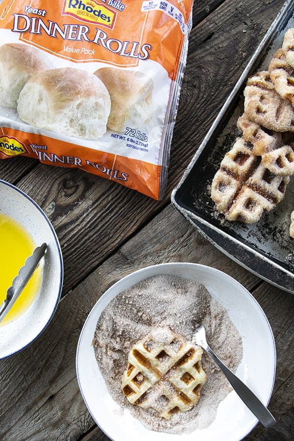 Crispy edged, cinnamon-sugar dusted Churros Waffles are 100% irresistible and ridiculously easy to make, taking advantage of frozen dough for the base. Bonus: No boiling oil!