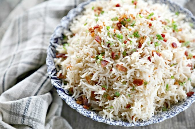 Bacon Garlic Rice; tender grains of basmati rice bursting with bacon, fried garlic, and fresh green onion. It's a flavour explosion that is great with grilled chicken, fish, beef, or pork, or nibbled straight from the fridge at midnight.